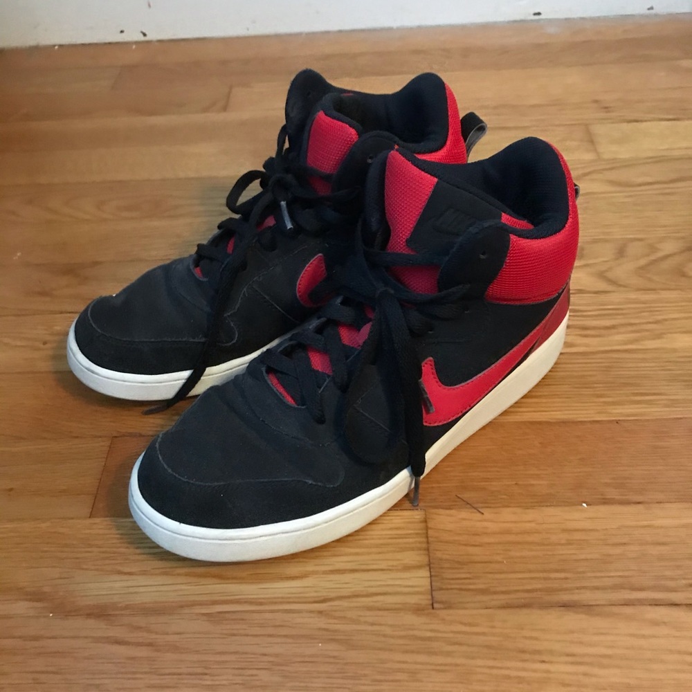 Red and black Nike hightop shoes